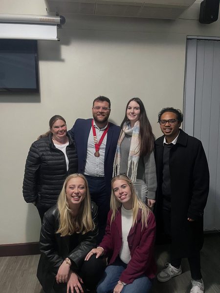 Stuart takes the chain — Wynberg Rotaract president.