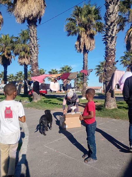 Sunday distribution — sandwich packs going out to kids in the southern suburbs.